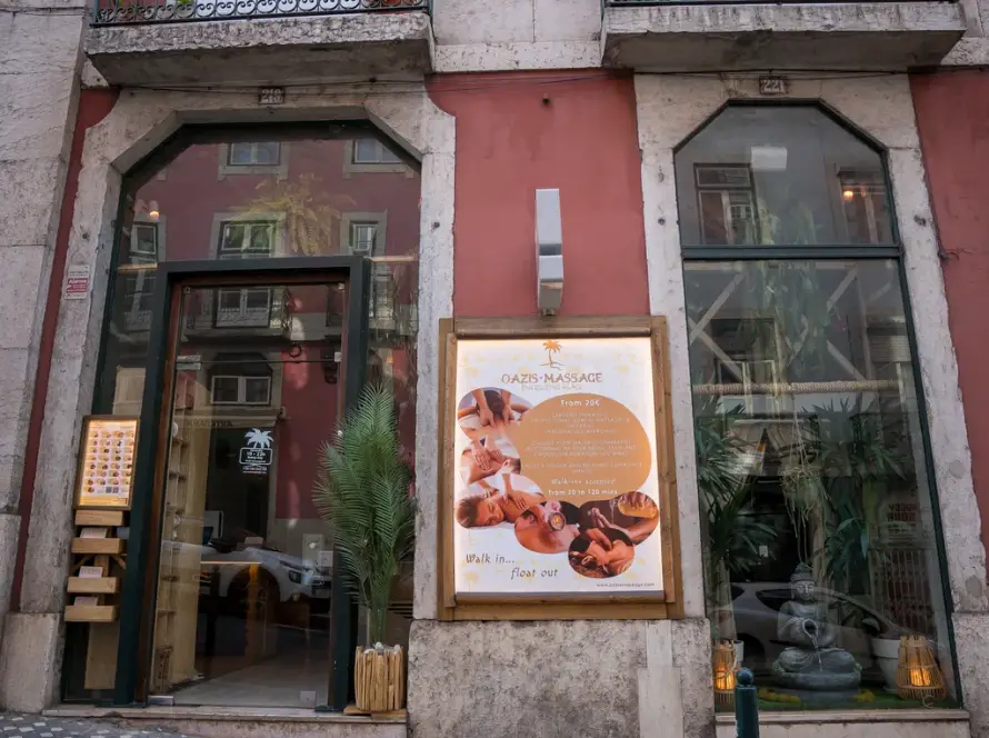Oazis Massage storefront at Rua da Madalena 219 in Lisbon, massage center open daily from 10AM to 10PM